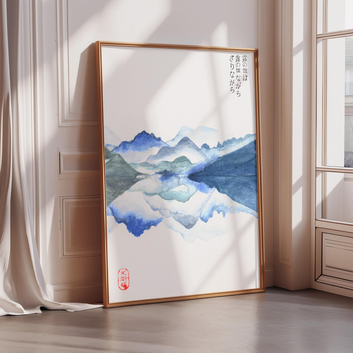 a large framed painting depicting a serene landscape with mountains and a lake, set against a white background.