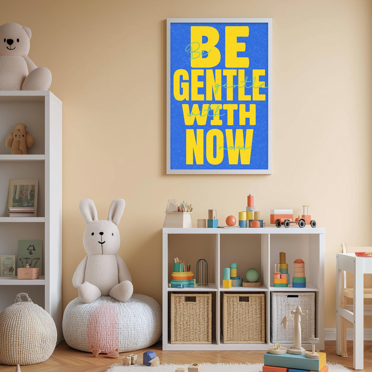 A child's bedroom with a large blue poster on the wall that says "BE GENTLE WITH NOW". The room is filled with various toys, including stuffed animals, and there is a bookshelf with books and other items.