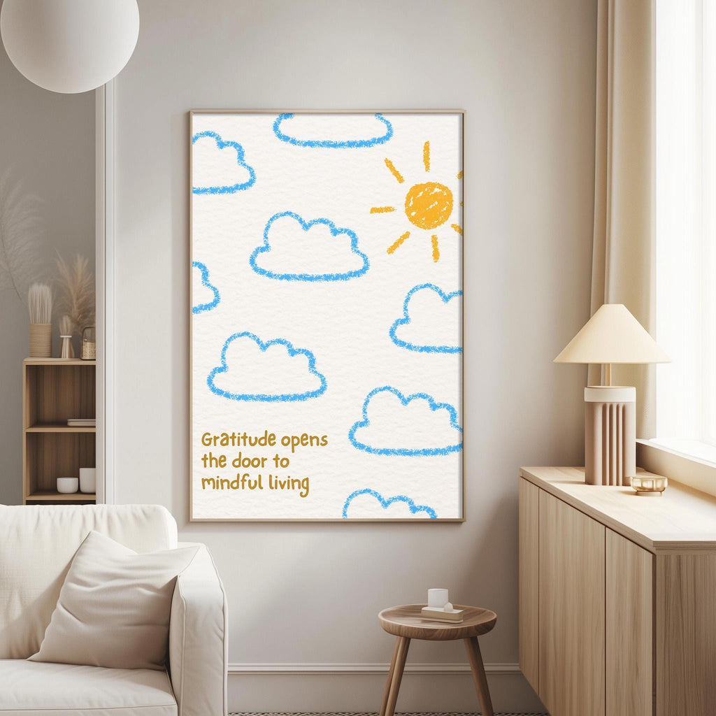 a living room with a white couch, a wooden side table, and a framed poster on the wall. The poster has a drawing of clouds and a sun, along with the text "Gratitude opens the door to mindful living".
