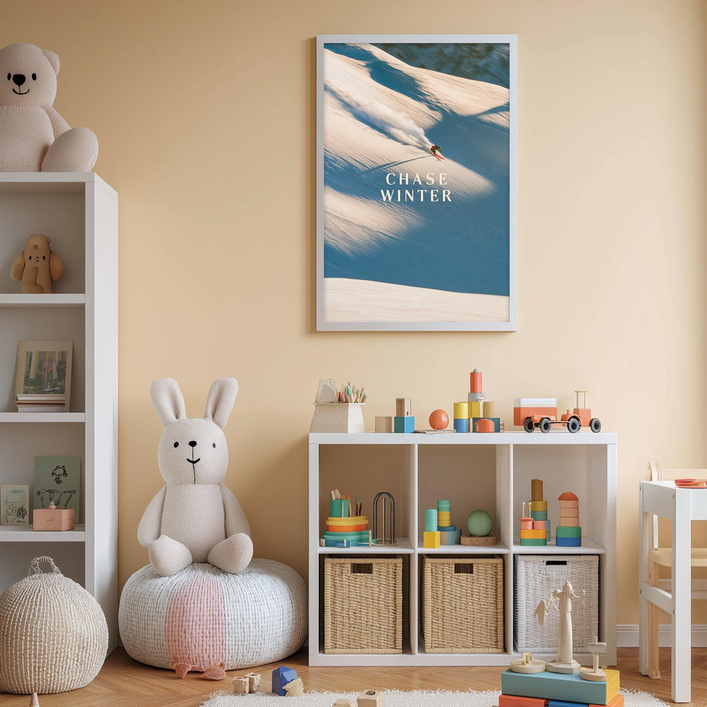A cozy children's room with a white rabbit sitting on a bean bag chair, surrounded by toys and storage bins. A framed poster of a snowy landscape with the word "CHASE WINTER" is displayed on the wall above the storage bins.