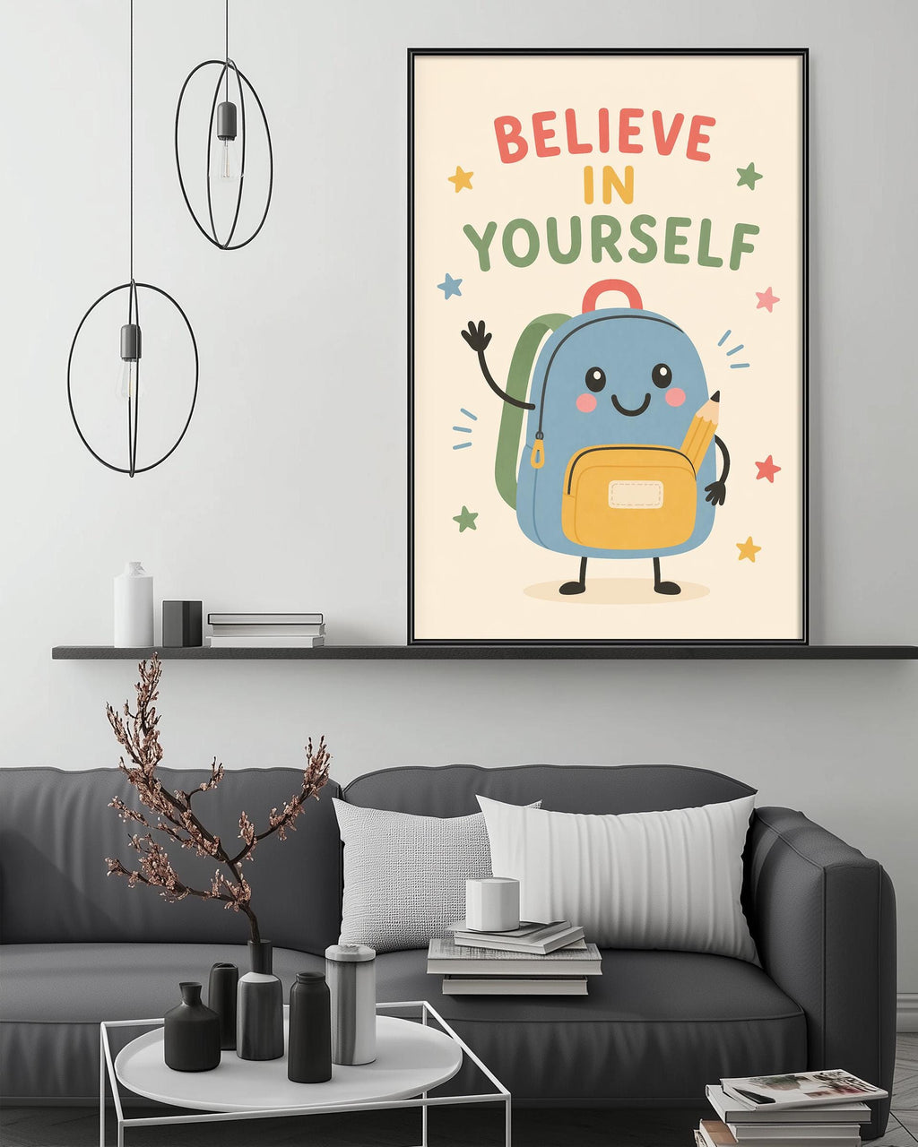 a cozy living room with a gray couch, a coffee table, and a bookshelf. Above the couch, there is a framed poster with a cartoon backpack and the text "Believe in yourself" written on it.