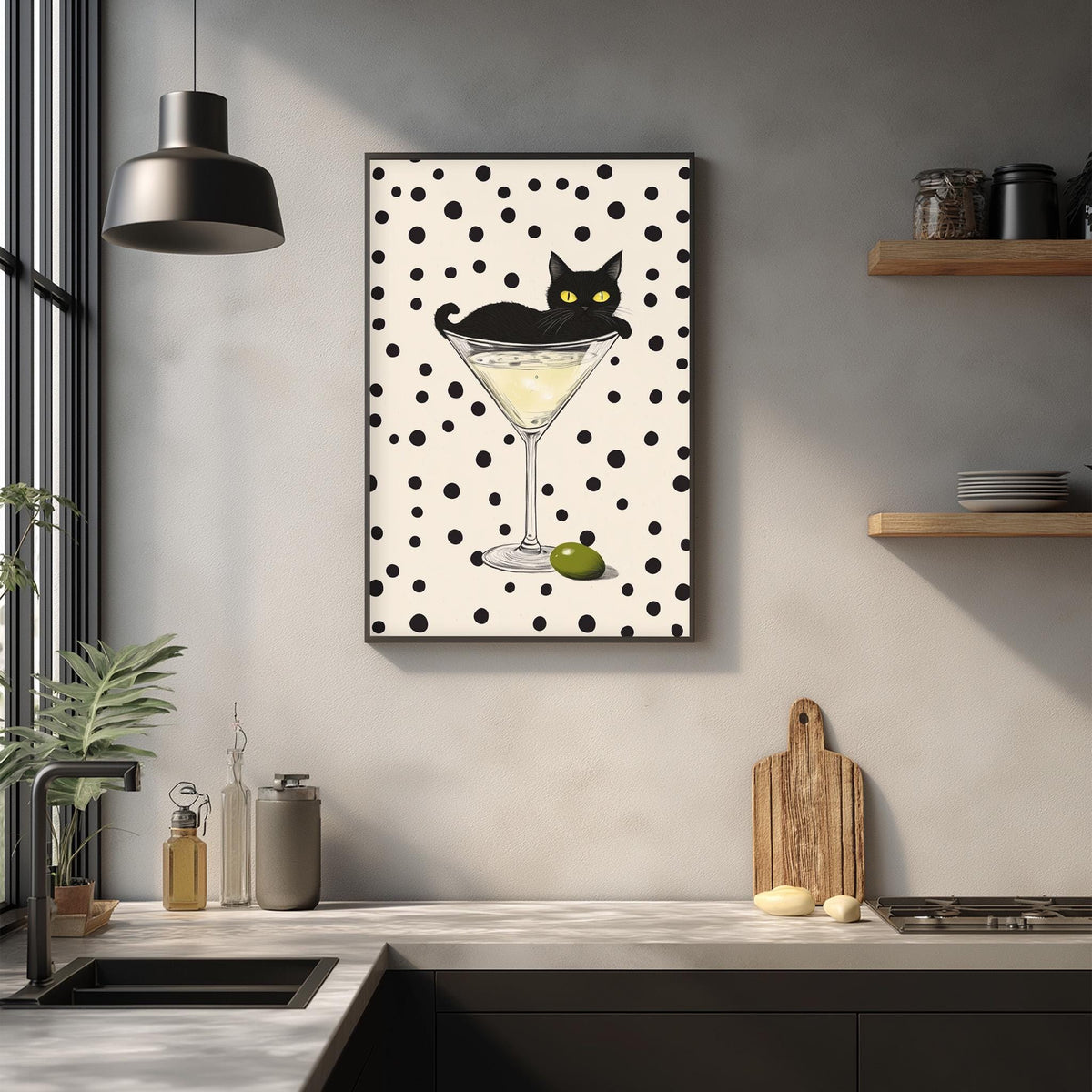 a kitchen counter with various kitchen items, including a framed picture of a cat sitting in a martini glass, a wooden cutting board, and a potted plant.