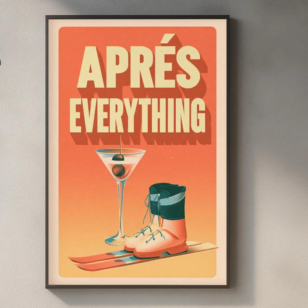 a framed poster with the text "APRÈS EVERYTHING" hanging on a wall above a kitchen counter.