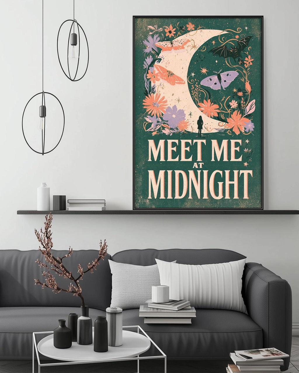 a cozy living room with a gray sofa, a coffee table, and a framed poster on the wall. The poster has a floral design and the text "Meet me at Midnight".