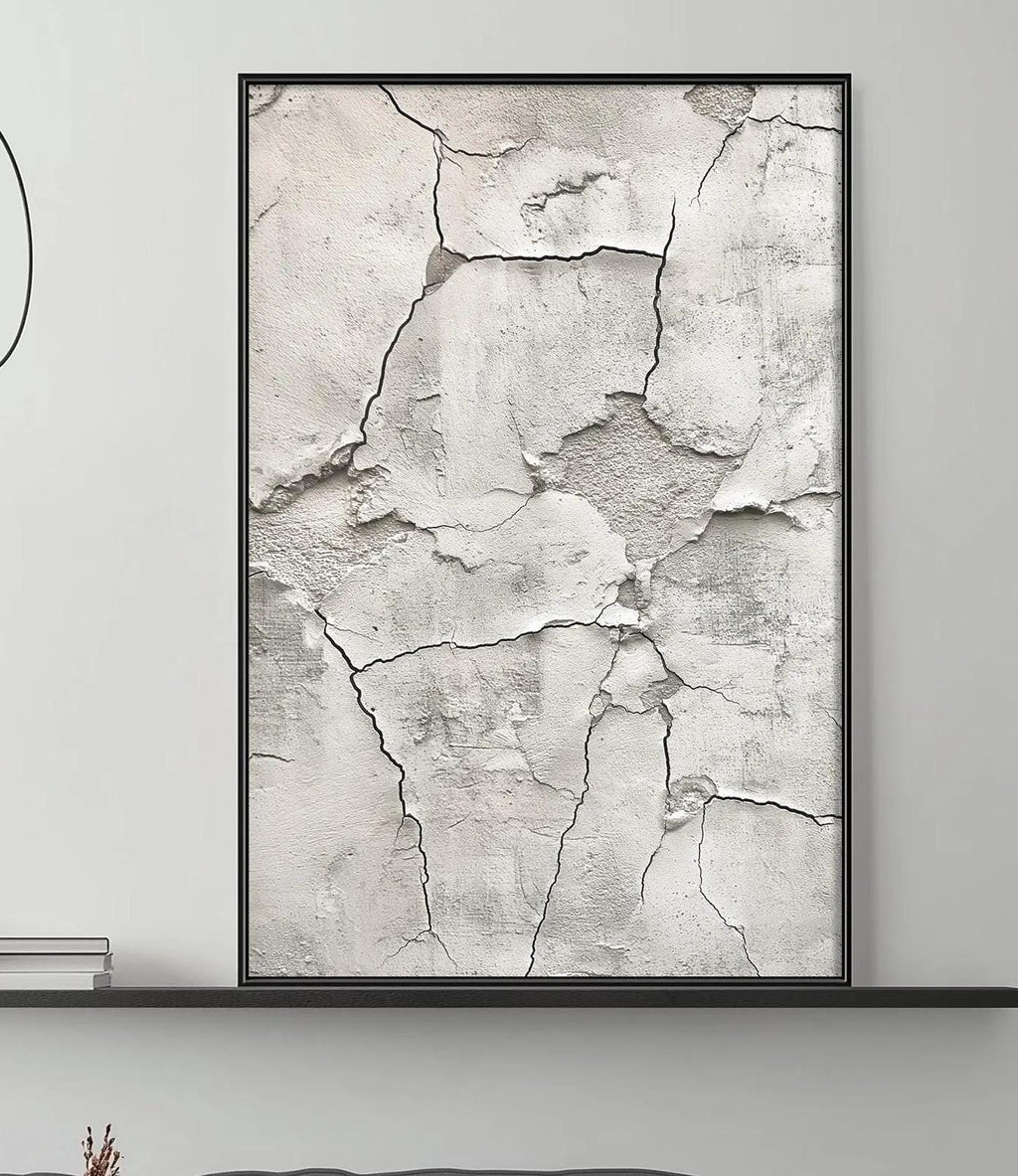 a modern living room with a gray sofa, a coffee table, and a large abstract painting on the wall.