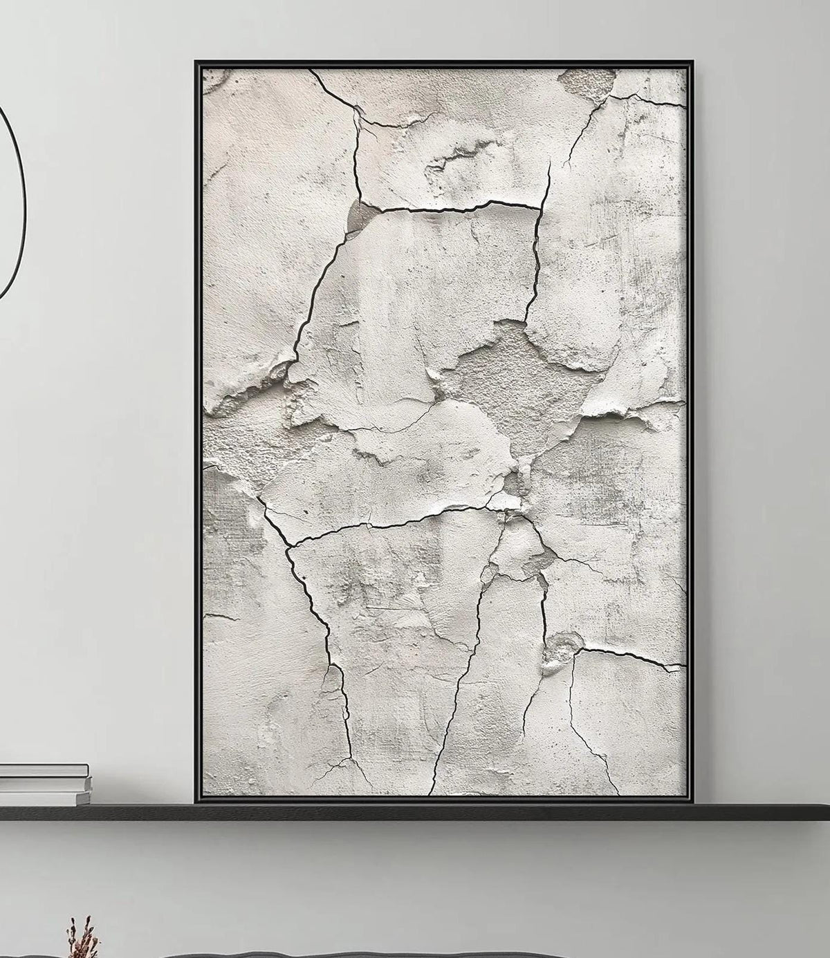 a modern living room with a gray sofa, a coffee table, and a large abstract painting on the wall.