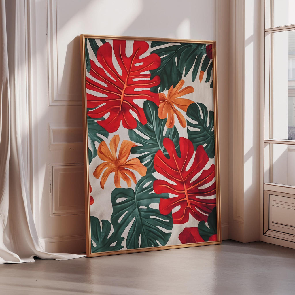 A large framed print with a vibrant tropical leaf pattern is displayed on a white wall in a room with a window.