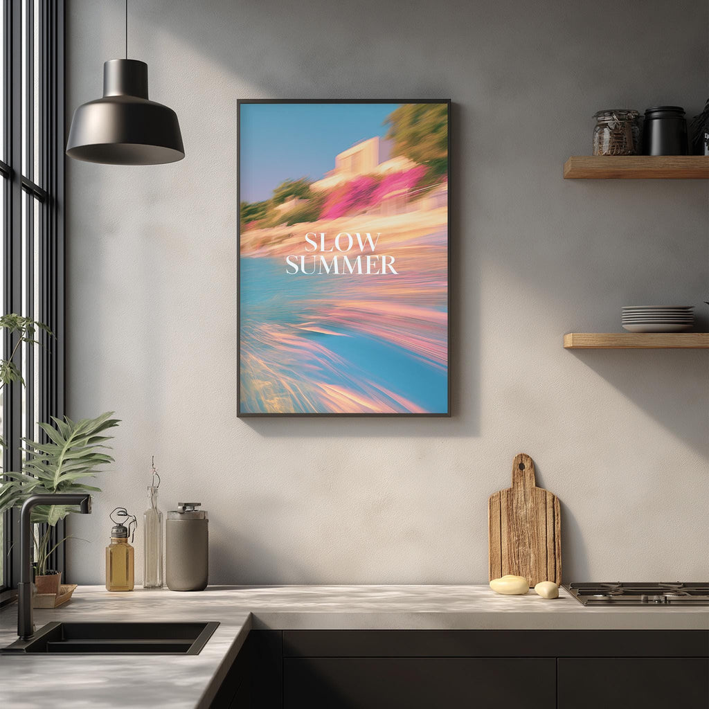 a kitchen counter with various items such as a cutting board, a bottle, and a vase. Above the counter, there is a framed poster with the text "SLOW SUMMER" displayed on it.