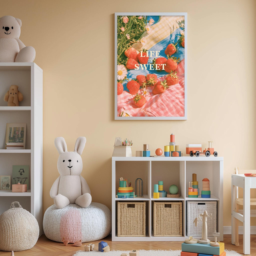 a cozy and colorful nursery room filled with various toys and storage containers. A large poster with the text "LIFE IS SWEET" and an image of strawberries is prominently displayed on the wall, adding a playful touch to the space.