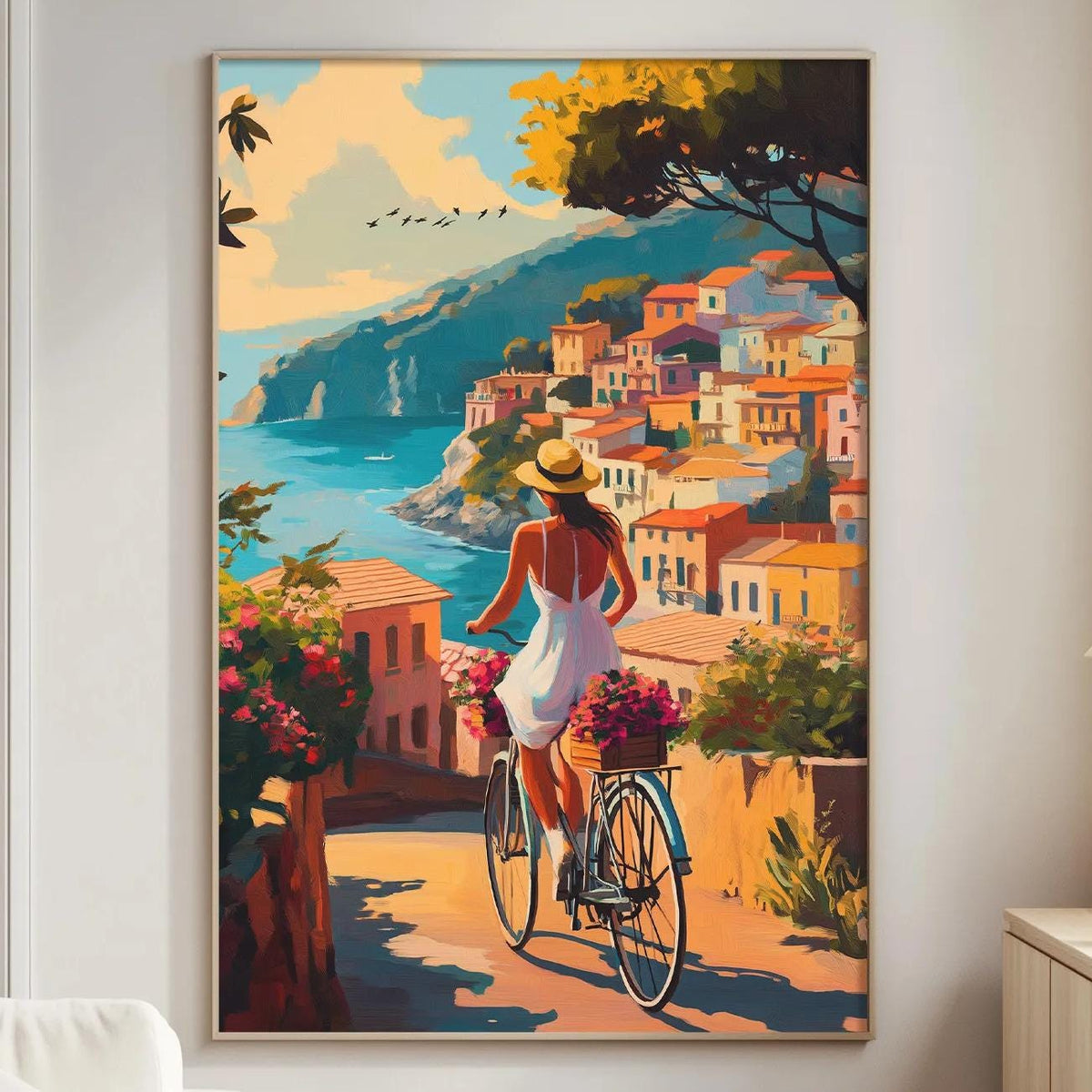 a woman riding a bicycle along a scenic coastal path, with colorful buildings and a picturesque view of the sea in the background.