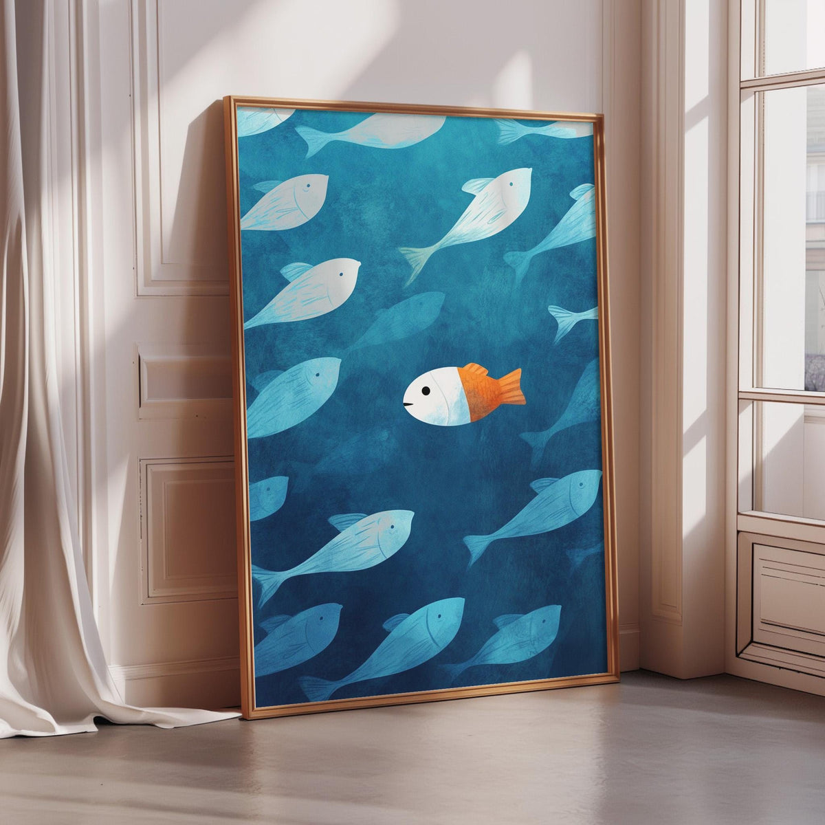 a large framed artwork depicting a group of fish swimming in a blue ocean, with one orange fish standing out among the blue fish.