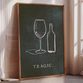 a framed poster with a chalkboard-style illustration of a wine glass and a wine bottle, accompanied by the word "TRAGIC."