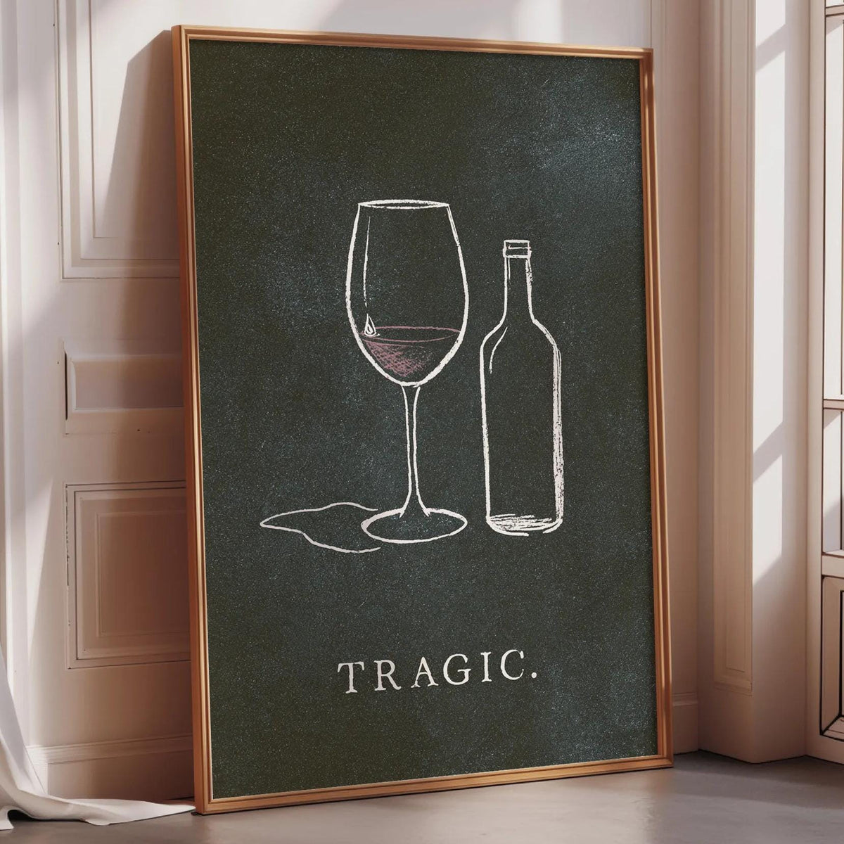 a framed poster with a chalkboard-style illustration of a wine glass and a wine bottle, accompanied by the word "TRAGIC."