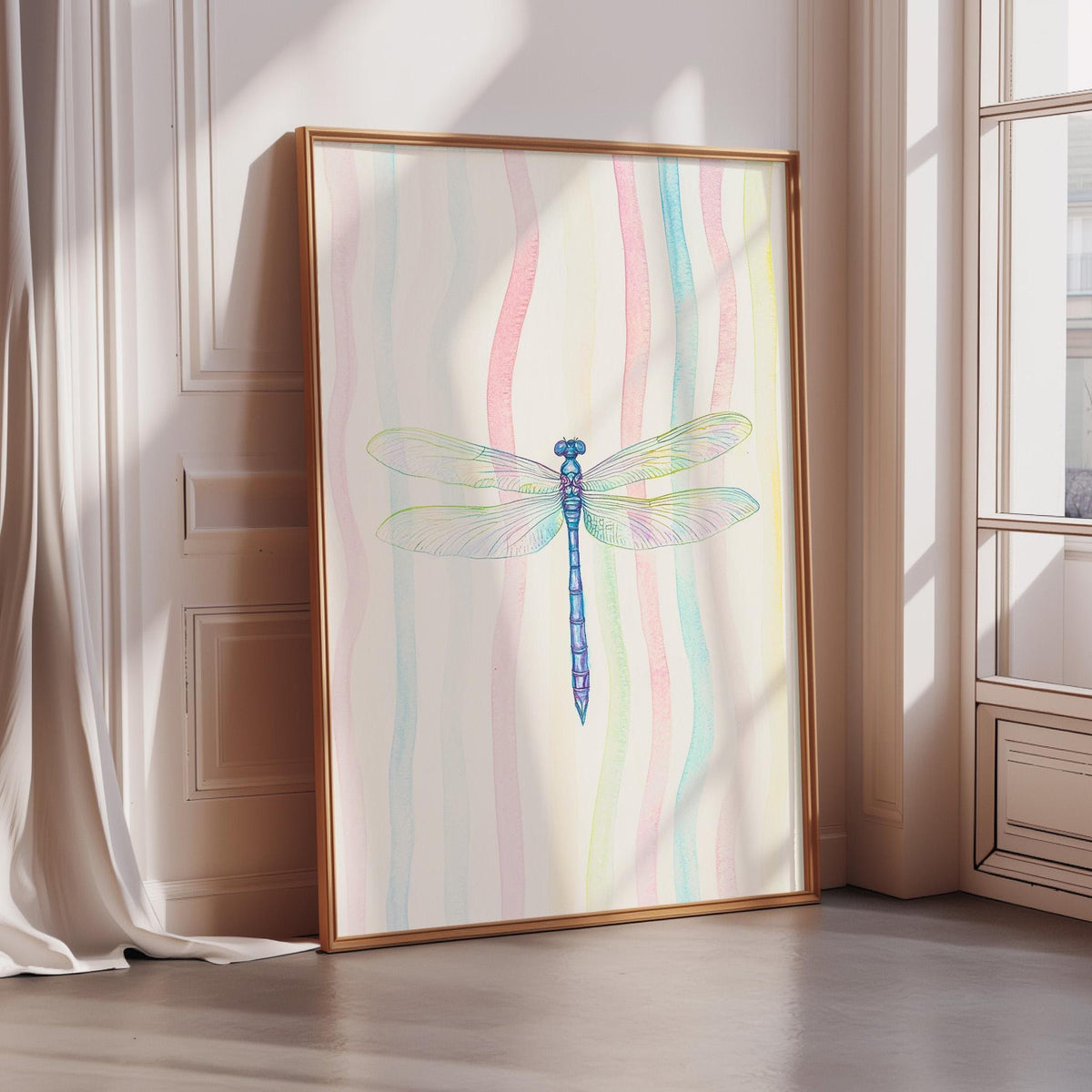 A framed painting of a colorful dragonfly is displayed on a wall in a room with sunlight streaming in through a window.