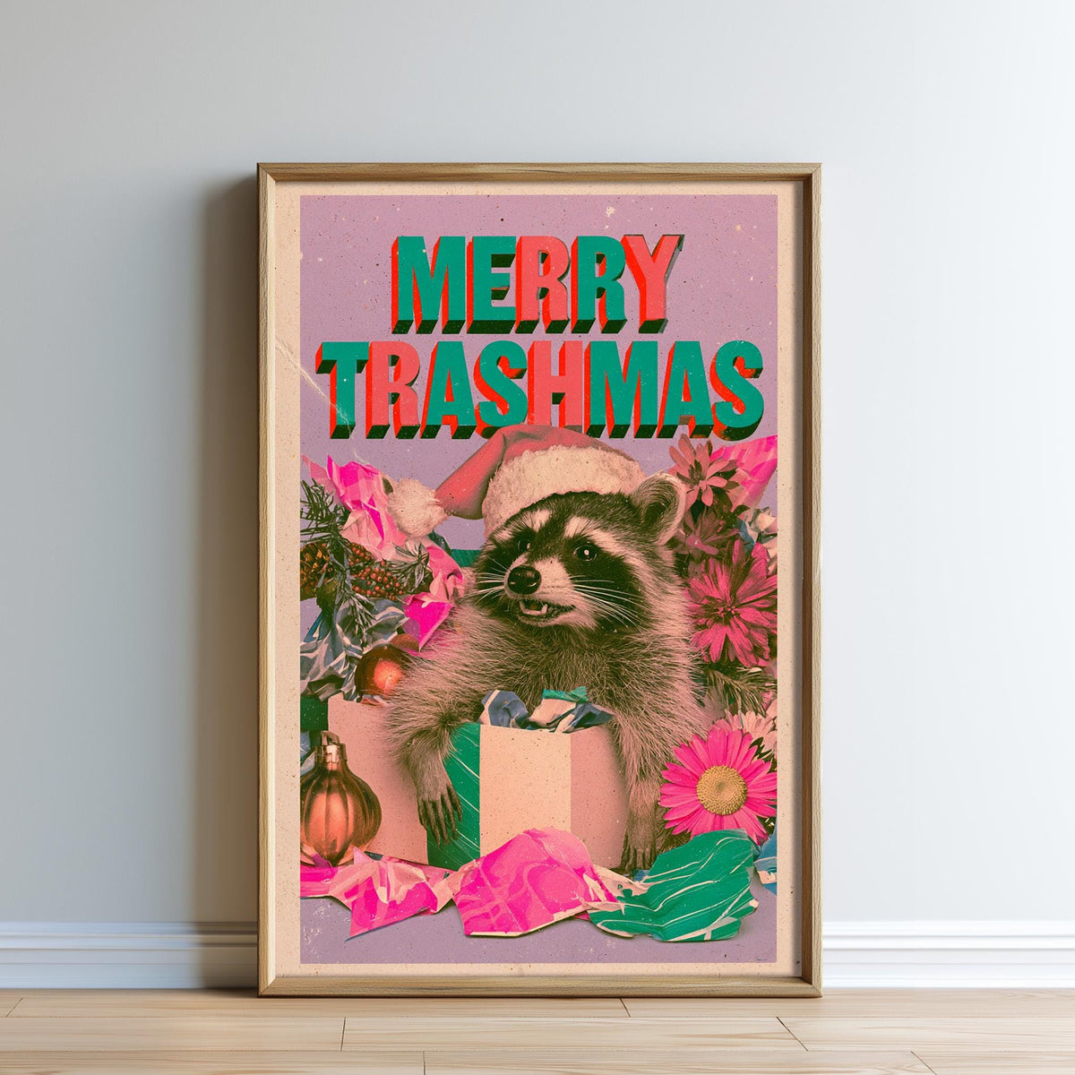 The image is a framed poster featuring a raccoon wearing a Santa hat and surrounded by Christmas decorations, with the text "MERRY TRASHMAS" prominently displayed.