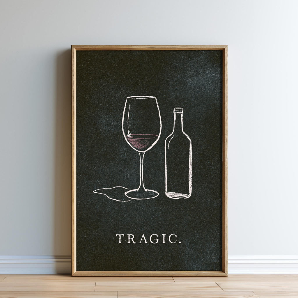 The image is a framed poster with a black background and white text. The poster features a wine glass and a wine bottle, along with the word "TRagic."