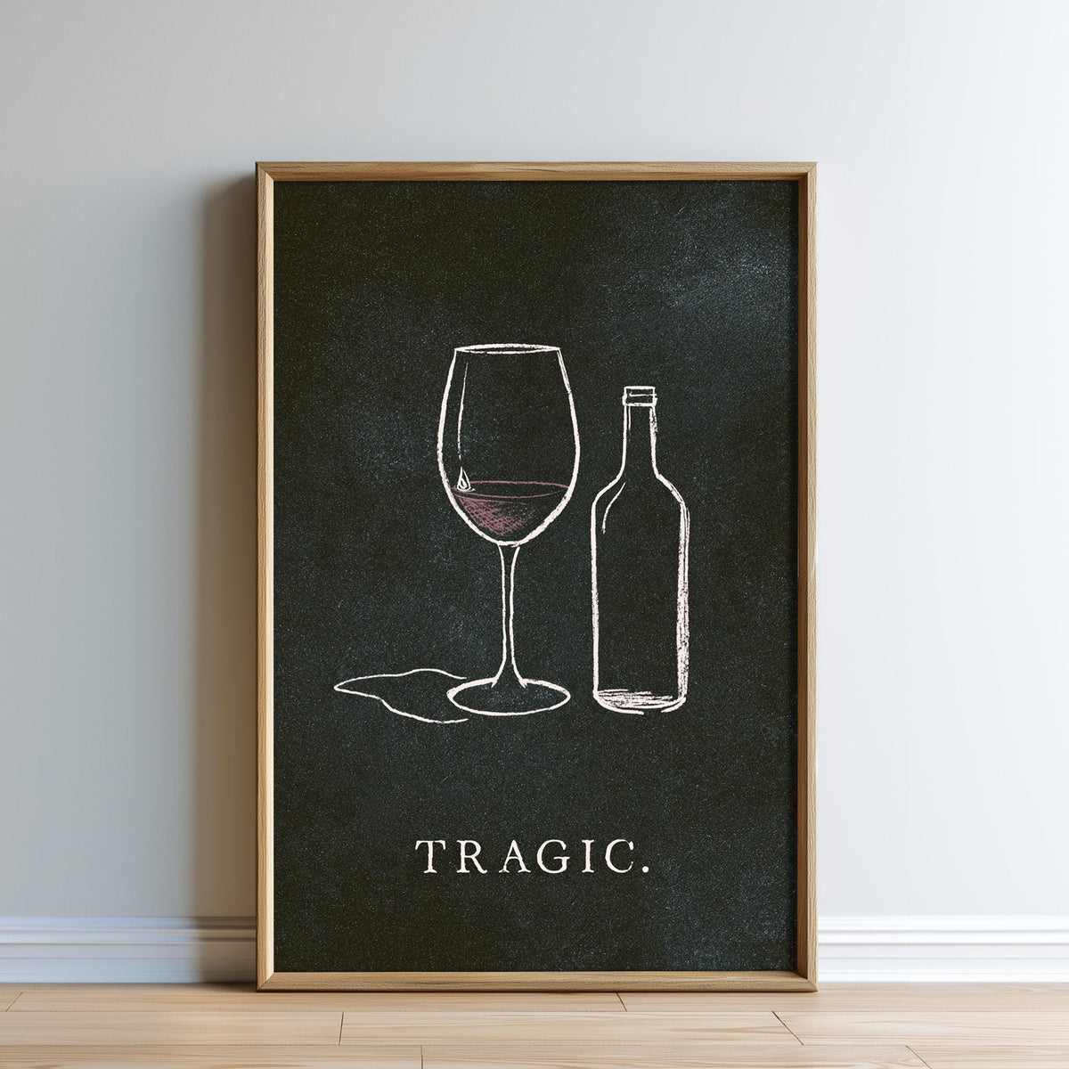 The image is a framed poster with a black background and white text. The poster features a wine glass and a wine bottle, along with the word "TRagic."