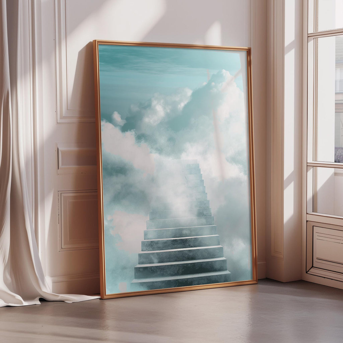 a large framed picture of a staircase leading up to a sky with clouds, placed on a wooden floor in a room with a window.