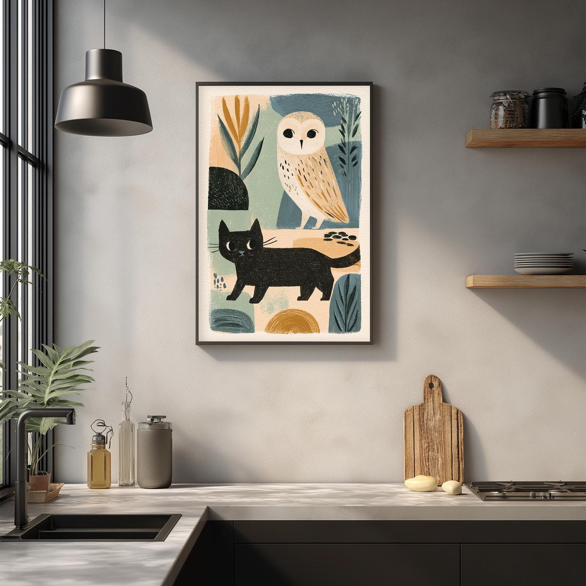 a kitchen counter with a framed artwork of an owl and a cat, along with various kitchen items such as a cutting board, a bottle, and a bowl.