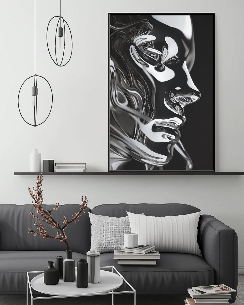 a modern living room with a gray sofa, a coffee table, and a large black and white portrait of a woman's face hanging on the wall above the sofa.