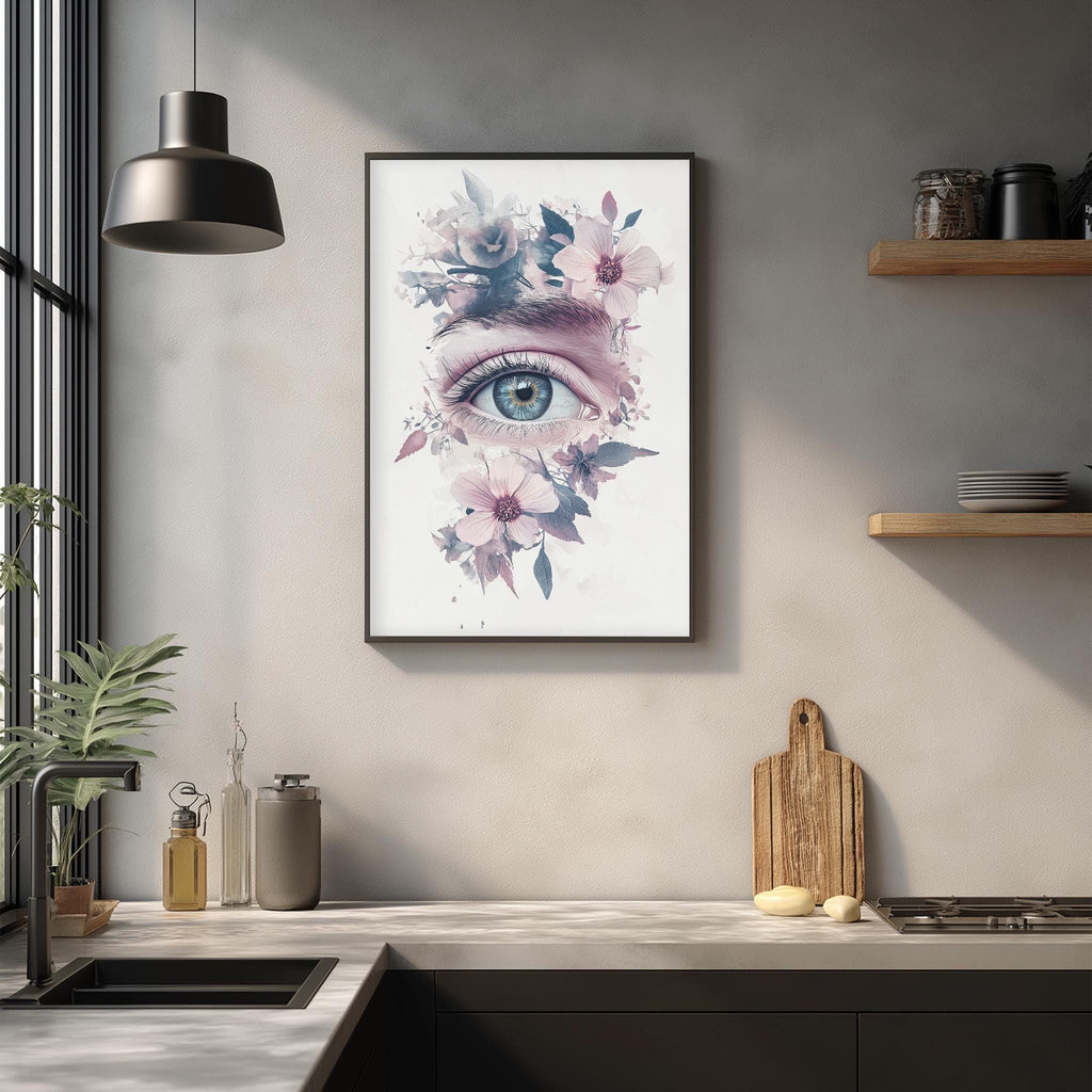 a framed artwork of a flower-filled eye on a wall, with a kitchen counter and various kitchen items in the foreground.