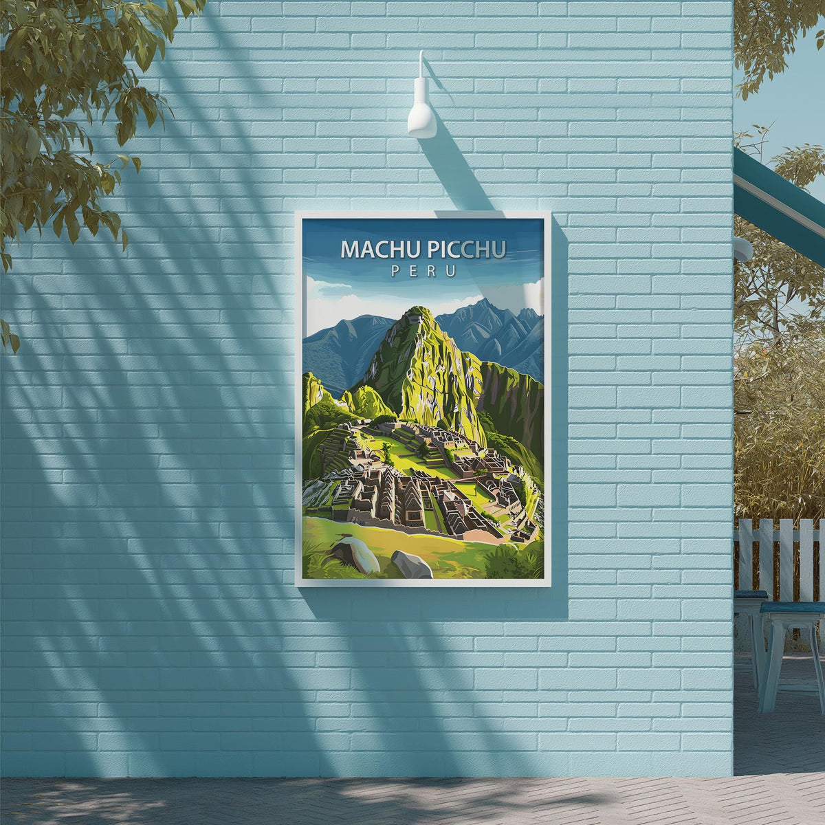 A framed poster of Machu Picchu, the ancient Inca citadel, is displayed on a light blue brick wall.