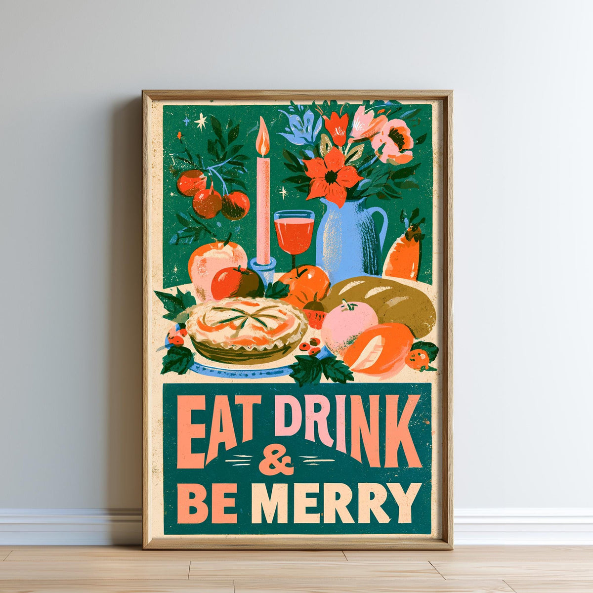 The image is a framed poster with a festive design featuring various food items, such as fruits, vegetables, and a candle, along with the text "EAT DRINK & BE MERRY".