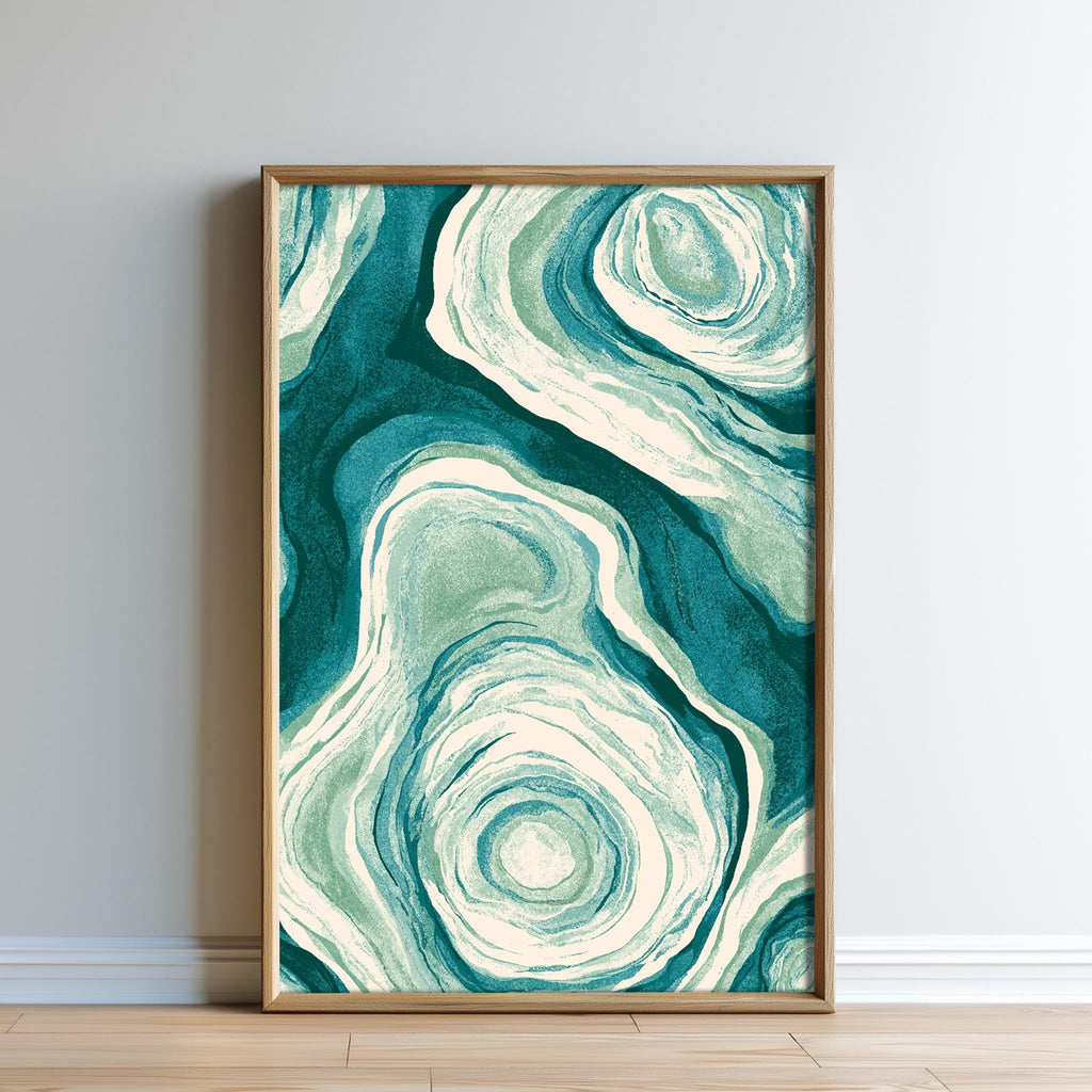 a framed abstract art piece with a swirling pattern of green and white colors.