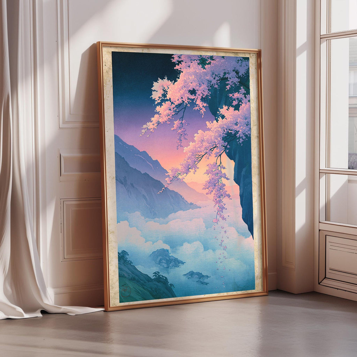 A large framed painting depicting a serene landscape with mountains, clouds, and cherry blossoms in the foreground.