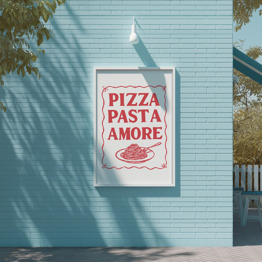 A framed sign on a blue wall that reads "PIZZA PASTA AMORE" with a picture of spaghetti and meatballs below it.