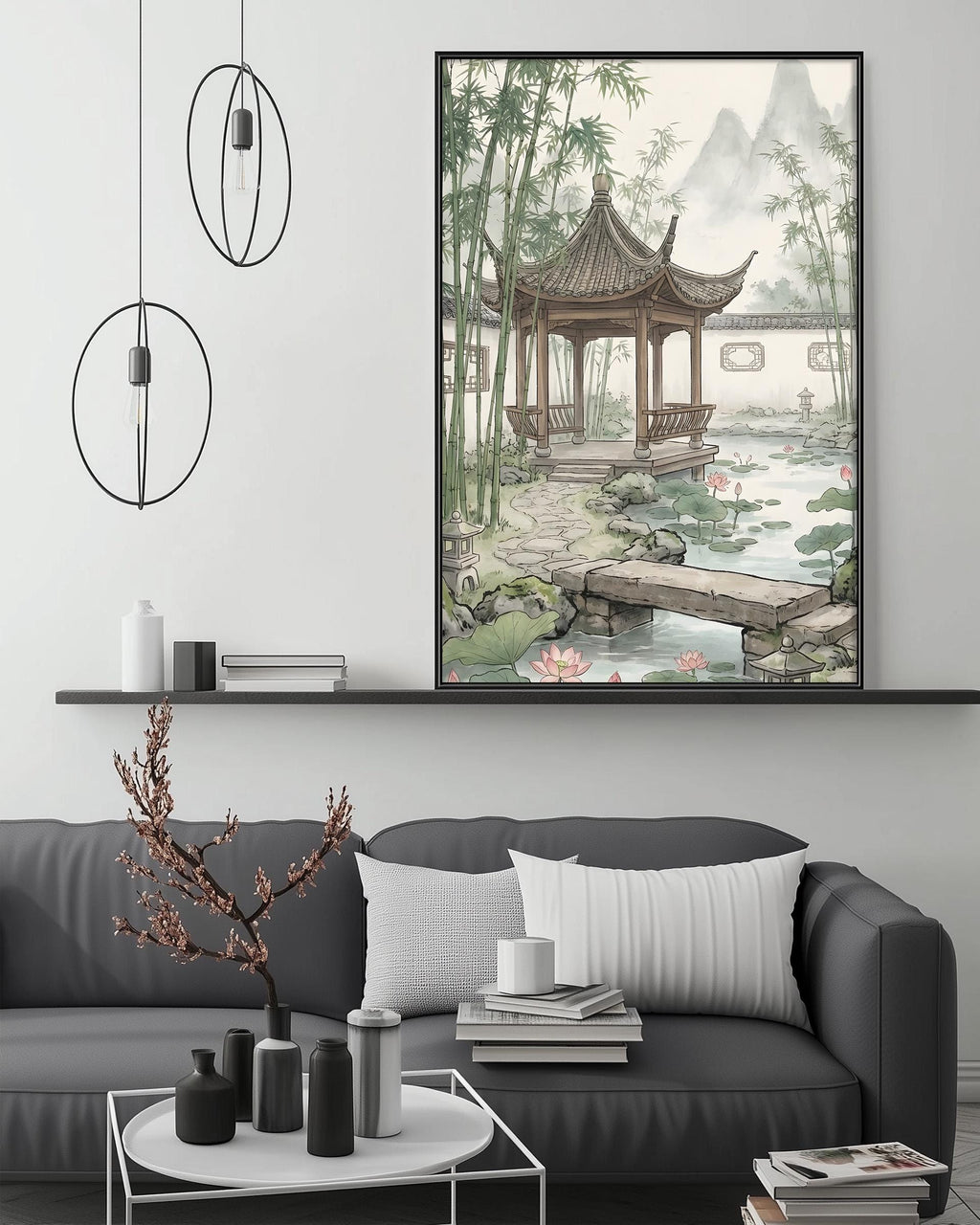 a living room with a gray sofa, a coffee table, and a large framed painting of a traditional Chinese pavilion with a garden scene above it.