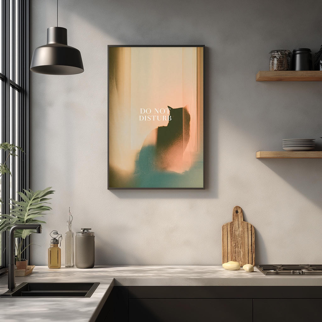 a kitchen counter with a framed poster hanging on the wall above it, along with various kitchen items such as a cutting board, a bottle, and a plant.