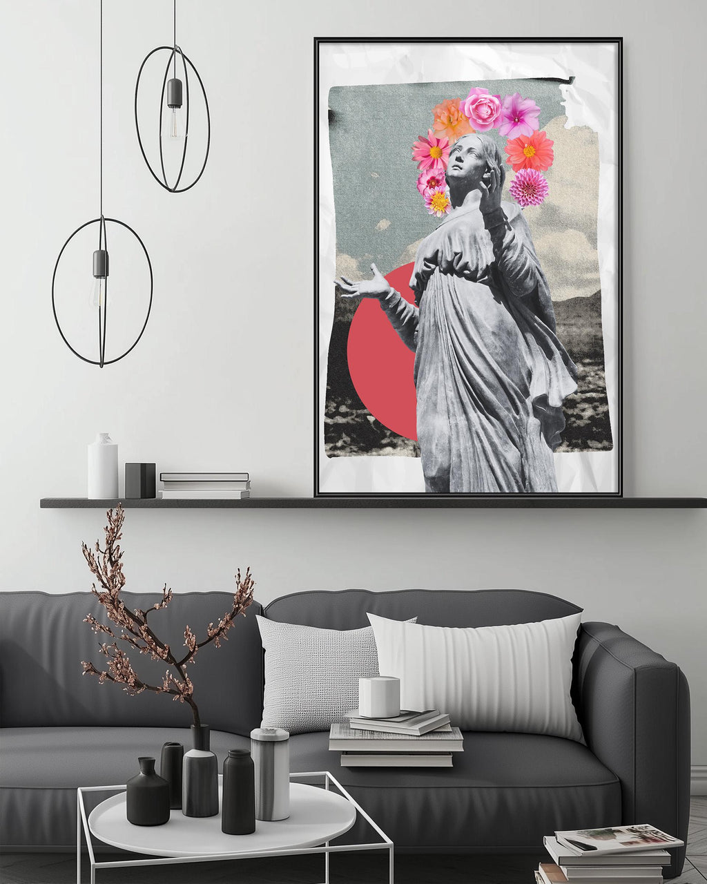 a modern living room with a gray sofa, a coffee table, and a framed artwork depicting a statue with a floral headpiece. The artwork is hanging on the wall above the sofa, creating a visually appealing focal point in the room.
