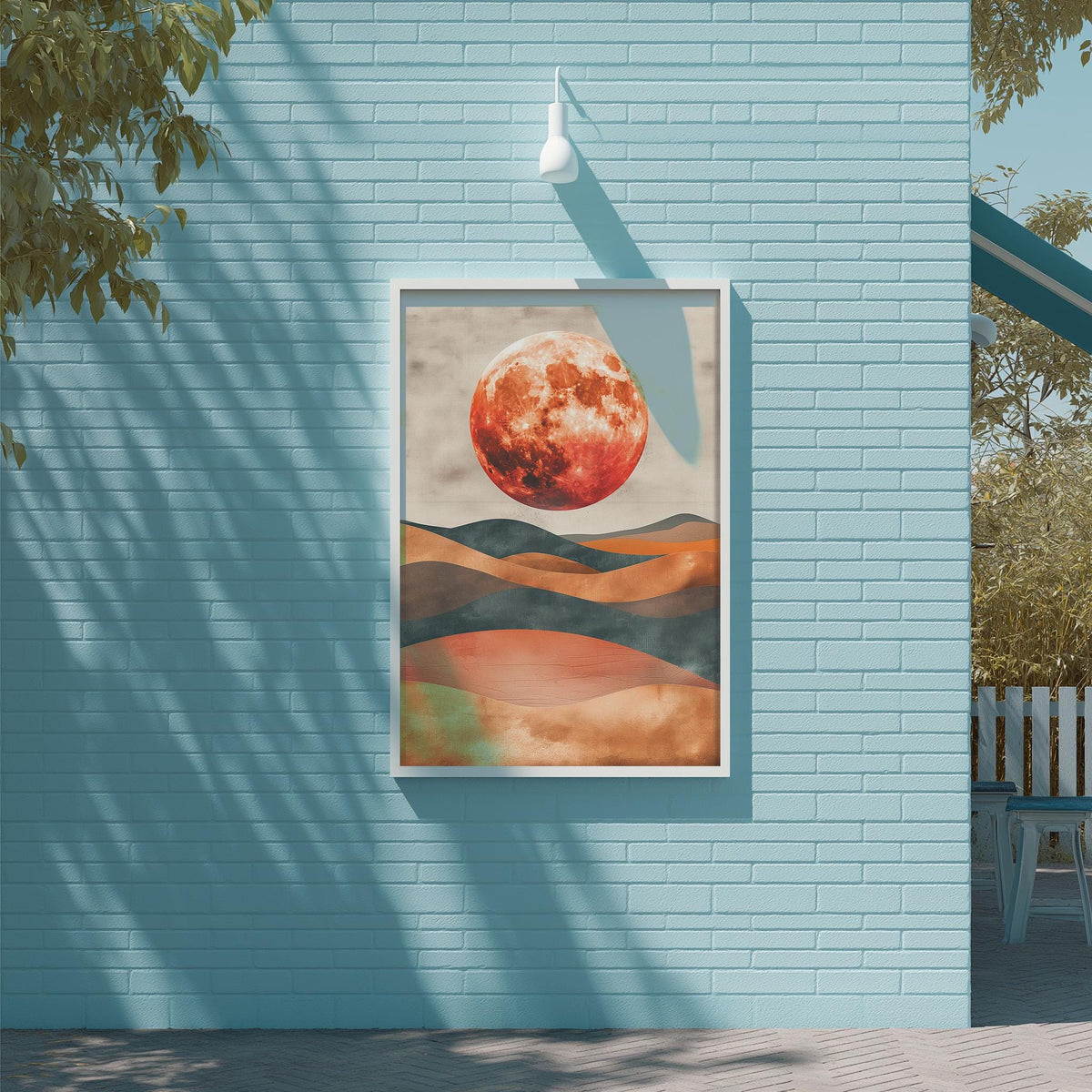 a large, vibrant painting of a red moon set against a mountainous landscape, hanging on a blue wall.