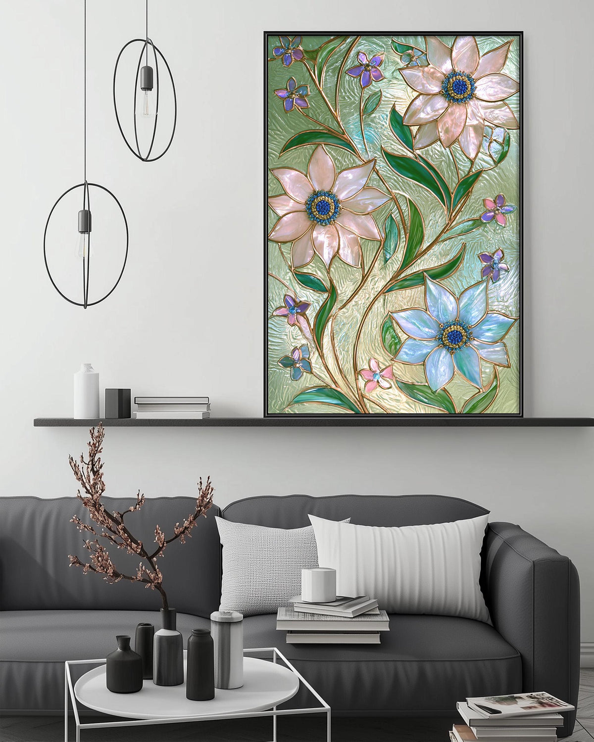 a large framed artwork of colorful flowers hanging on a wall above a gray couch in a living room setting.