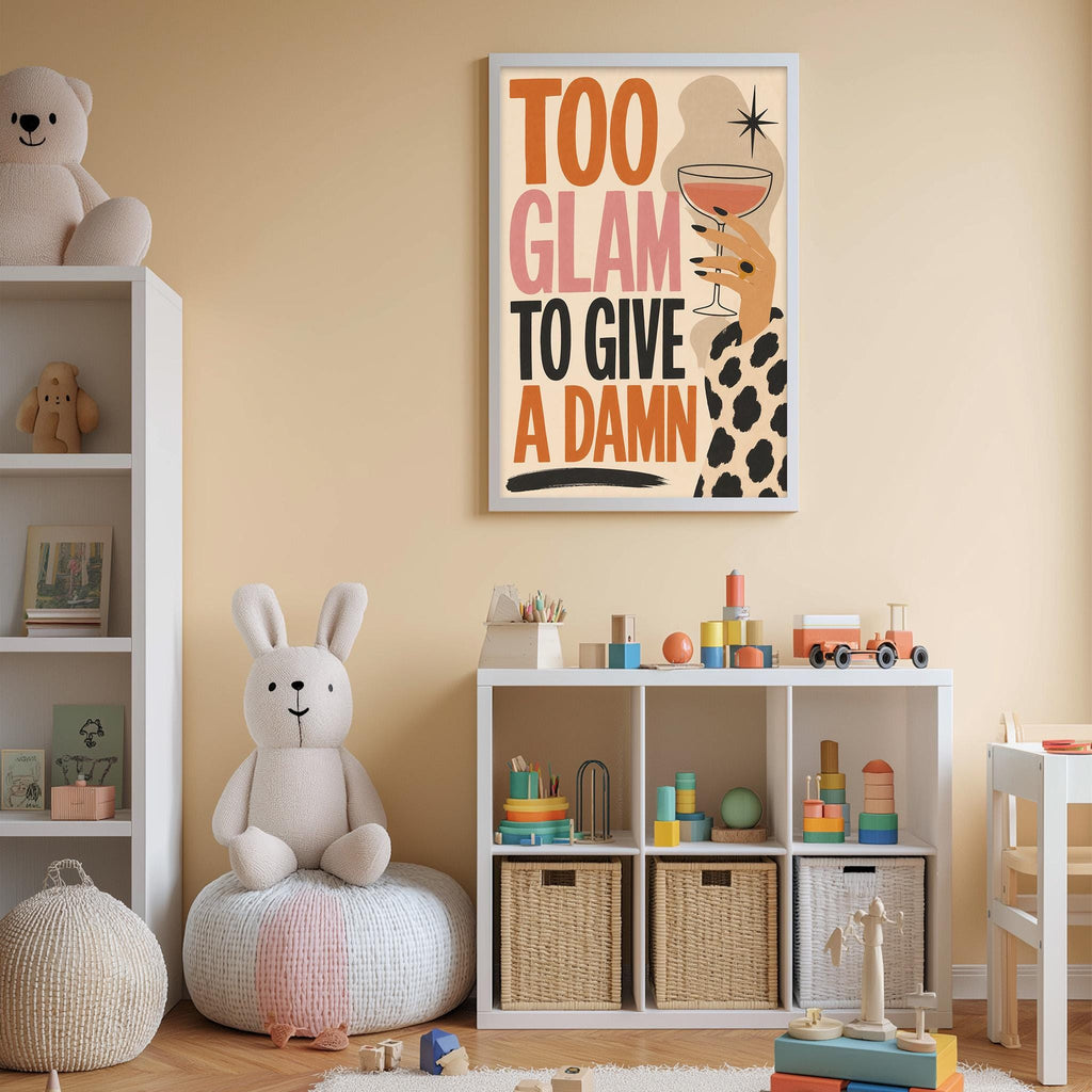 A child's bedroom with a white bookshelf, a stuffed rabbit, and a colorful poster on the wall. The poster features a woman with a drink and the text "Too Glam to Give a Damn".