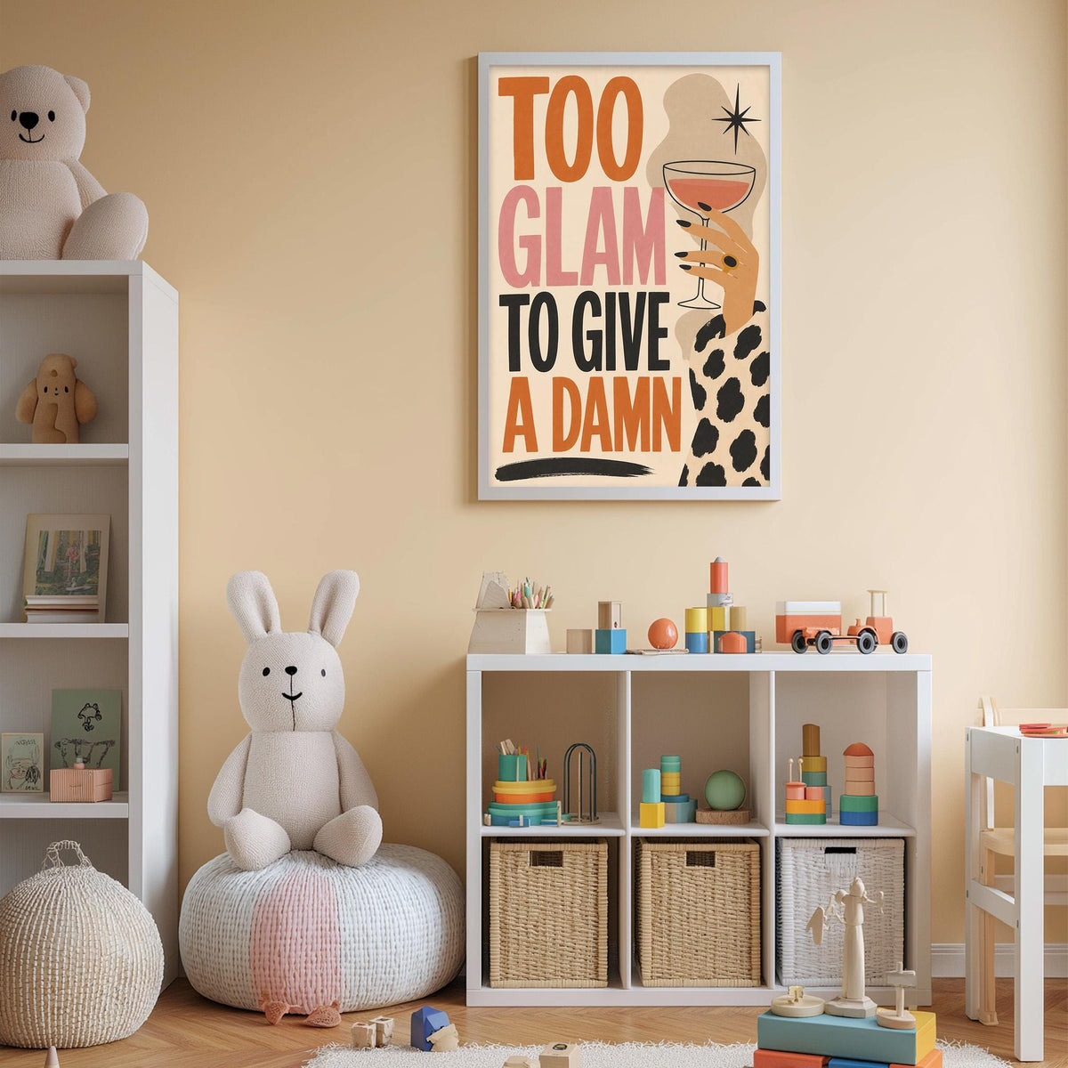 A child's bedroom with a white bookshelf, a stuffed rabbit, and a colorful poster on the wall. The poster features a woman with a drink and the text "Too Glam to Give a Damn".