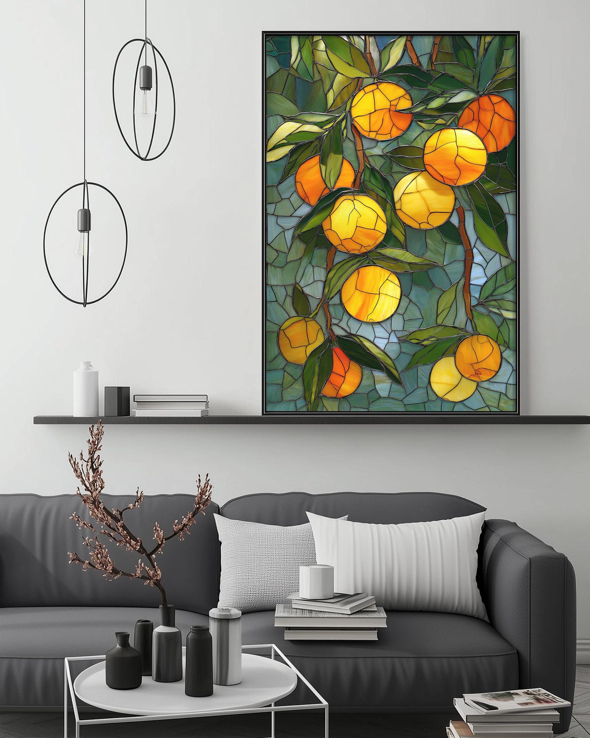 a modern living room with a gray sofa, a coffee table, and a large framed stained glass artwork depicting a vibrant display of oranges hanging from branches.