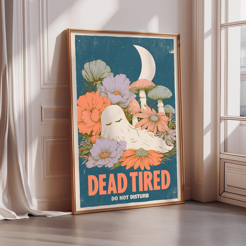 a framed poster with a whimsical, artistic design. The poster includes a crescent moon, flowers, and a ghost-like figure, creating a unique and visually appealing composition. The text "DEAD TIRED DO NOT DISTURB" is prominently displayed, adding a humorous and thought-provoking message to the artwork.