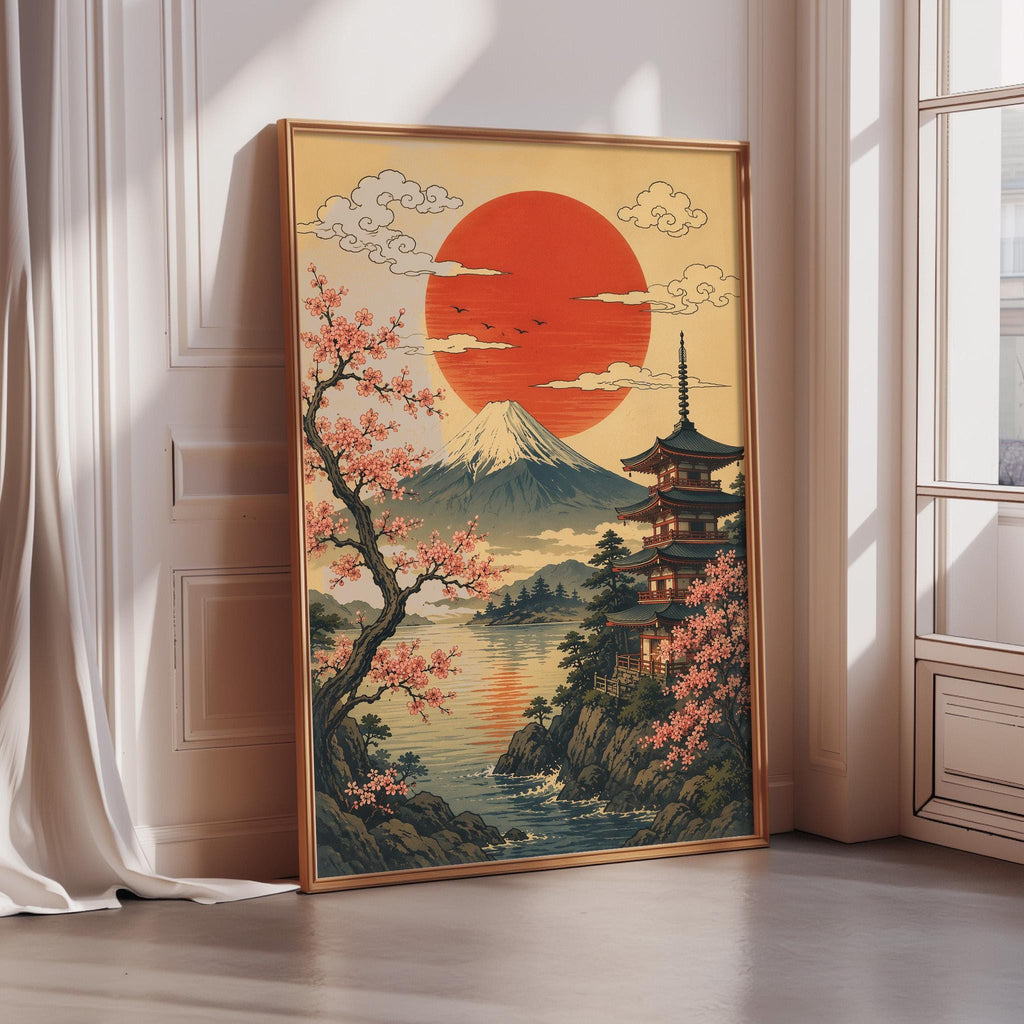 A framed painting depicting a serene Japanese landscape with a temple, cherry blossoms, and a large sun in the sky.