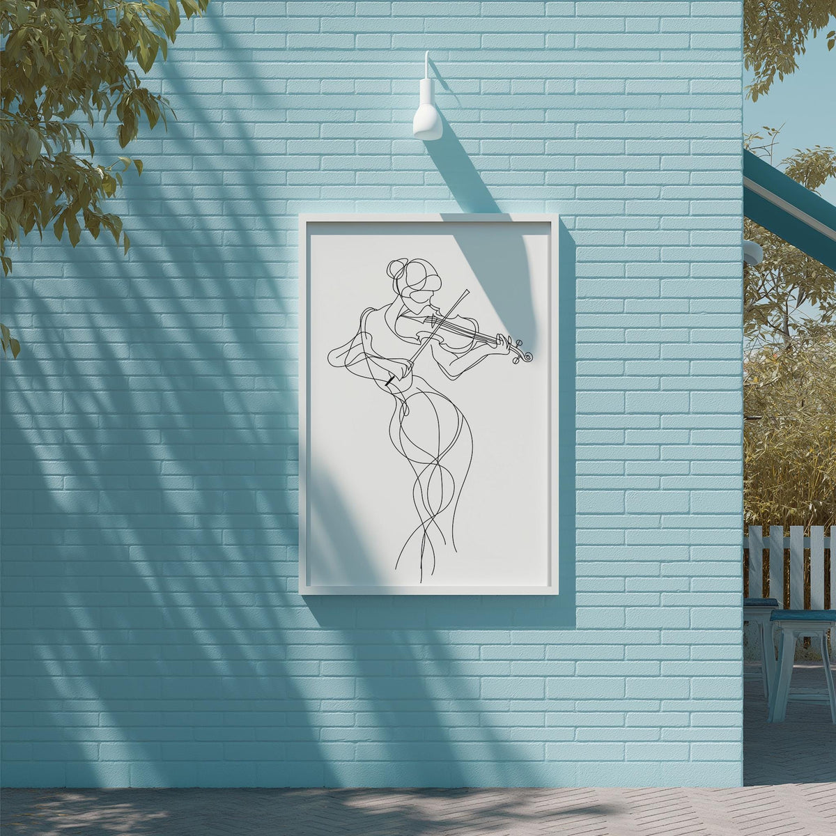 a framed drawing of a woman playing a violin on a blue wall.