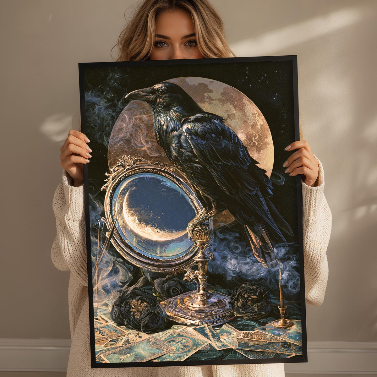 A woman holds up a framed artwork depicting a black crow perched on a golden candlestick, with a full moon and a mirror in the background.