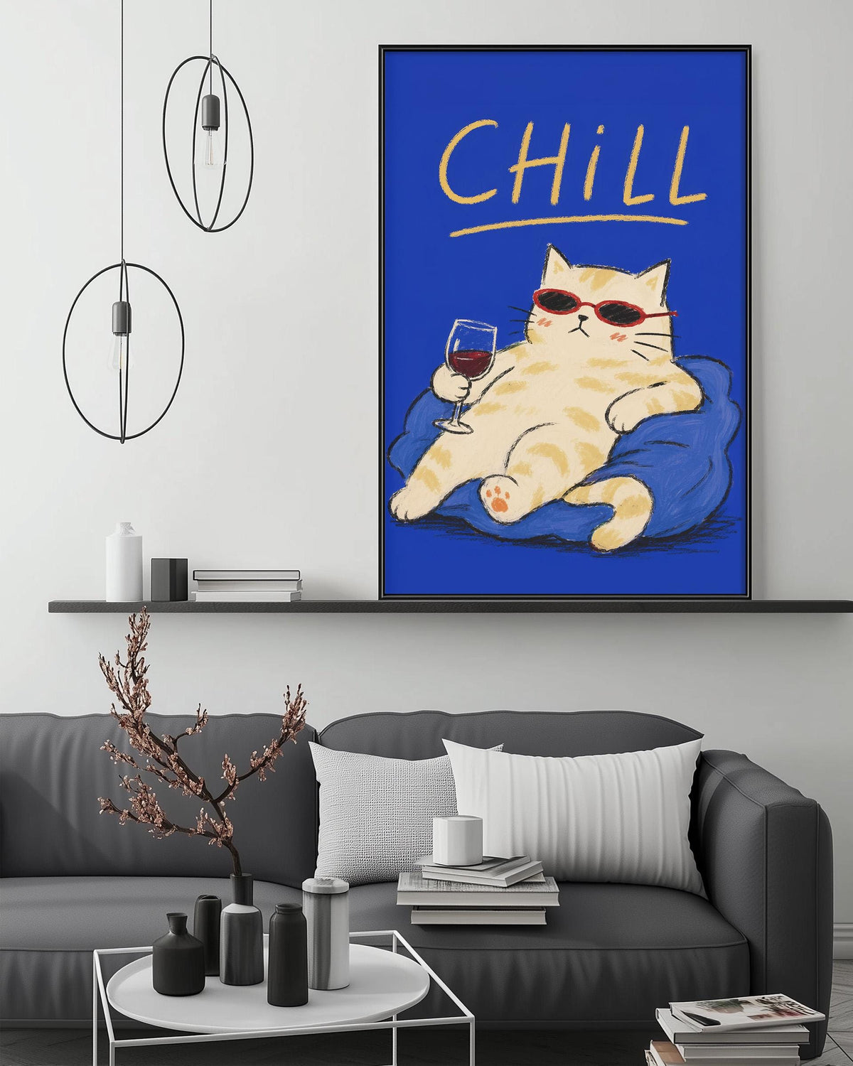 a cozy living room with a gray couch, a coffee table, and a large framed poster of a cat wearing sunglasses and holding a glass of wine.