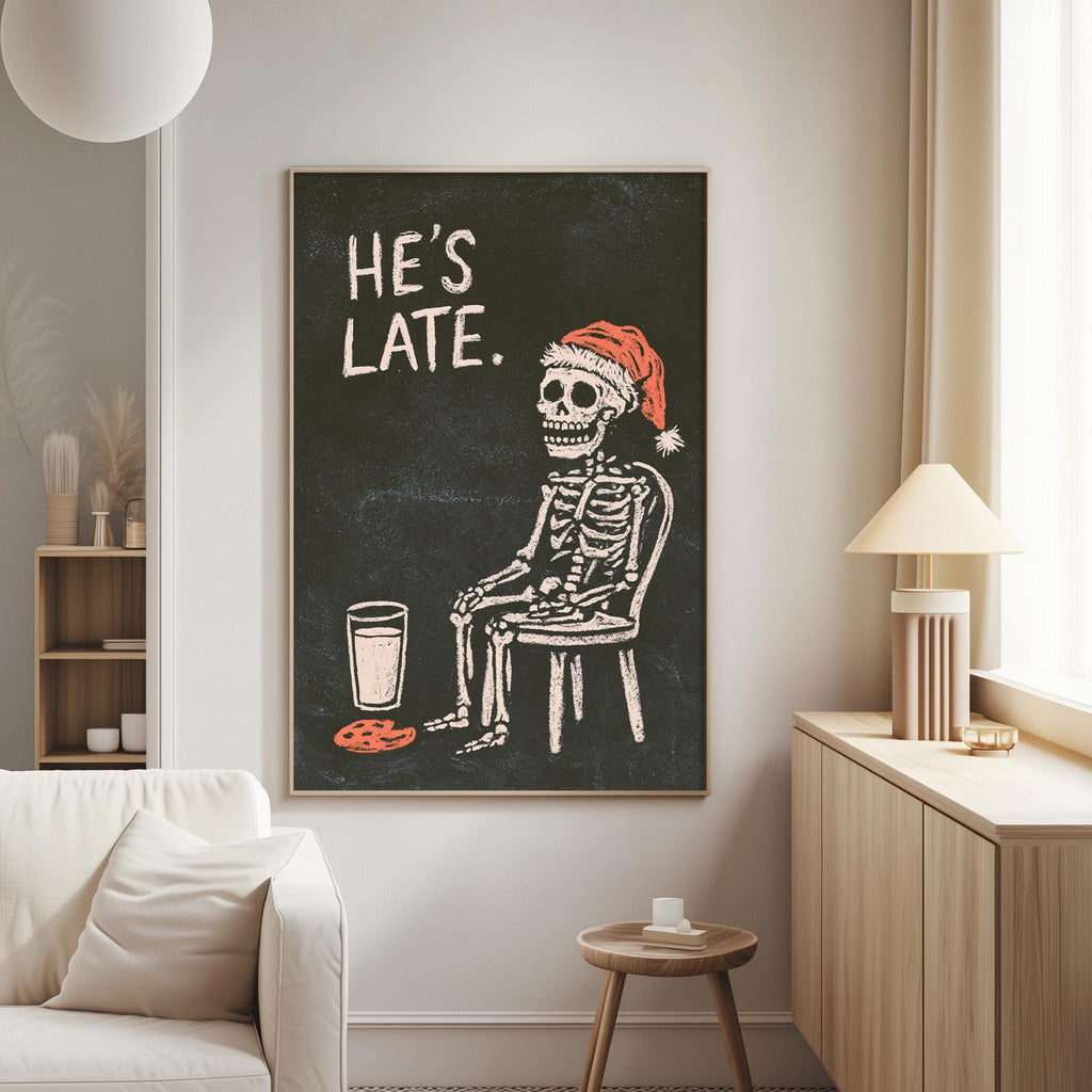 a skeleton wearing a Santa hat and sitting in a chair, with the text "HE'S LATE."