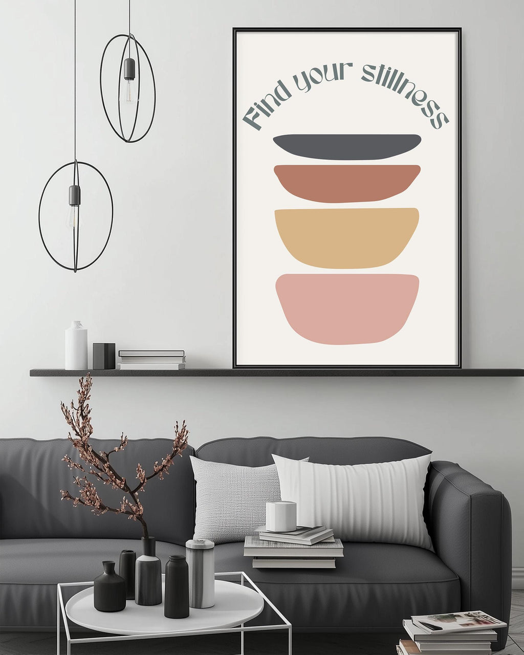 a modern living room with a gray sofa, a coffee table, and a framed poster with a minimalist design on the wall.