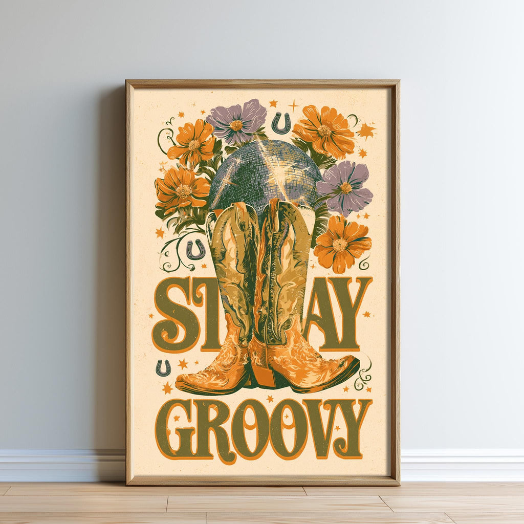 The image is a framed poster with a vibrant, colorful design featuring a pair of boots surrounded by flowers and the text "STAY GROOVY".