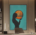 a modern and minimalist office space with a large abstract painting of a woman's silhouette on the wall, a wooden desk with a chair, and built-in bookshelves.