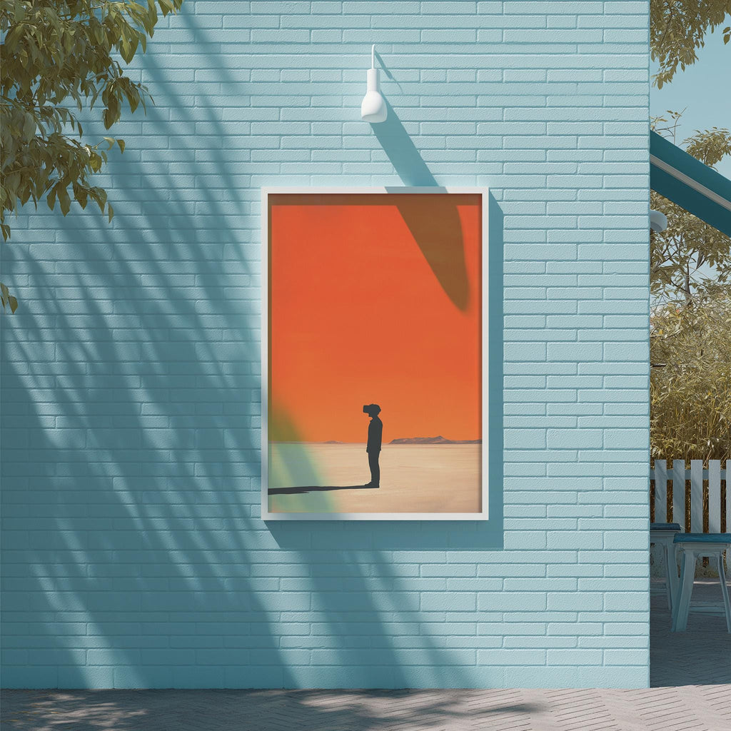 a blue brick wall with a framed picture of a person standing in front of a sunset.