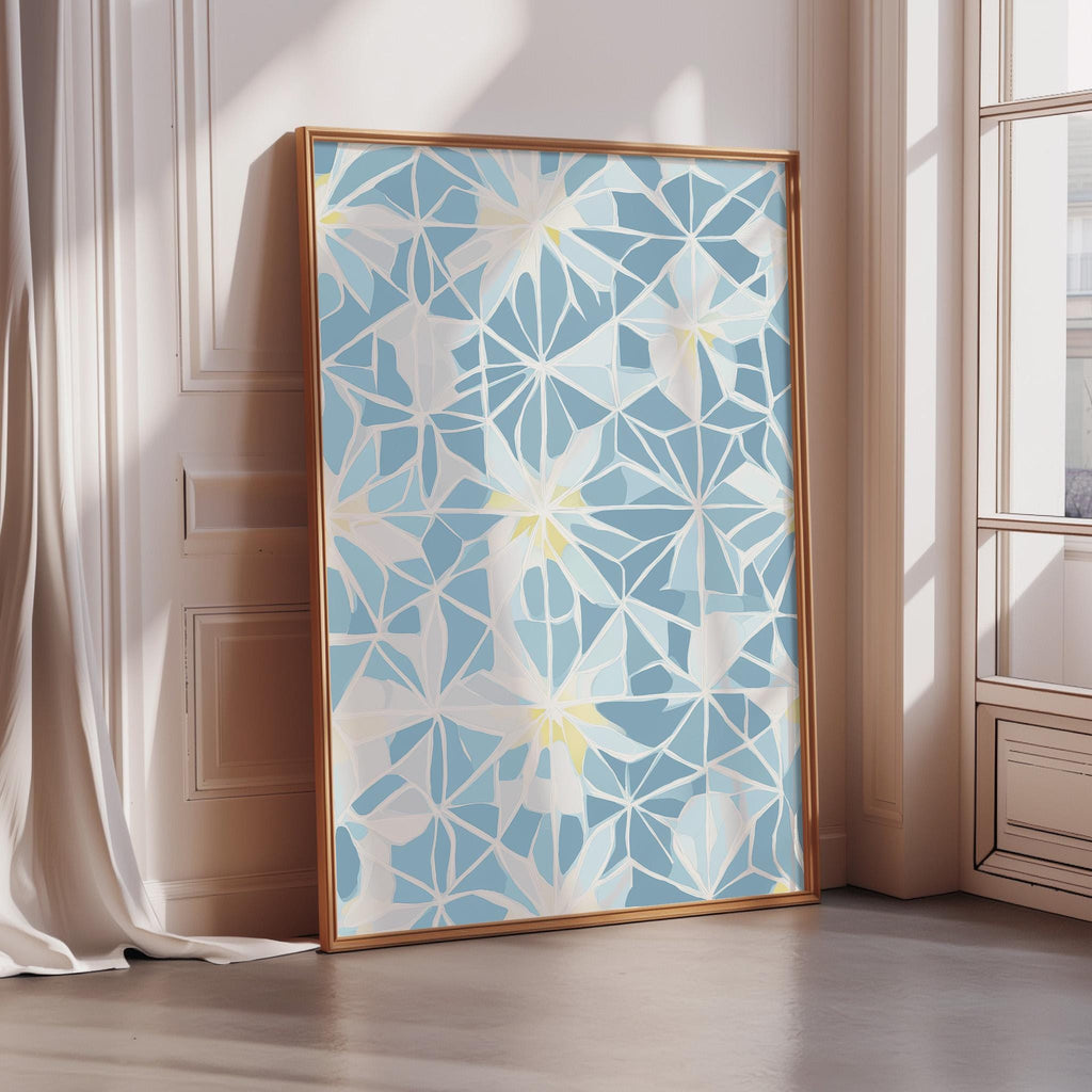 a large, framed artwork with a blue and white geometric pattern on a white wall.