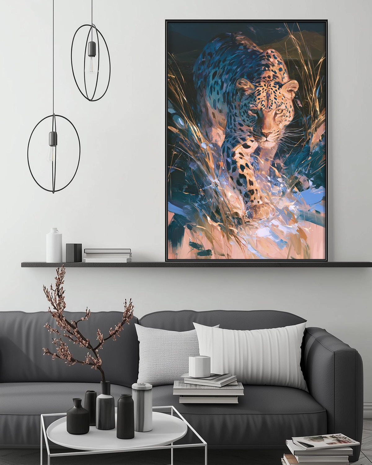 a large, vibrant painting of a leopard in a lush, natural setting, hanging on a wall above a gray couch in a modern living room.